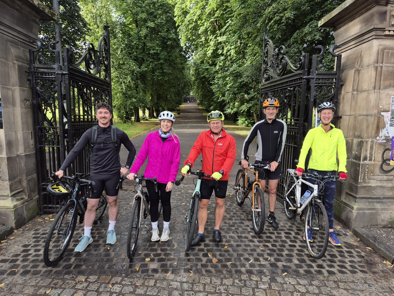 A group of clients and friends with their bikes on a cycling outing